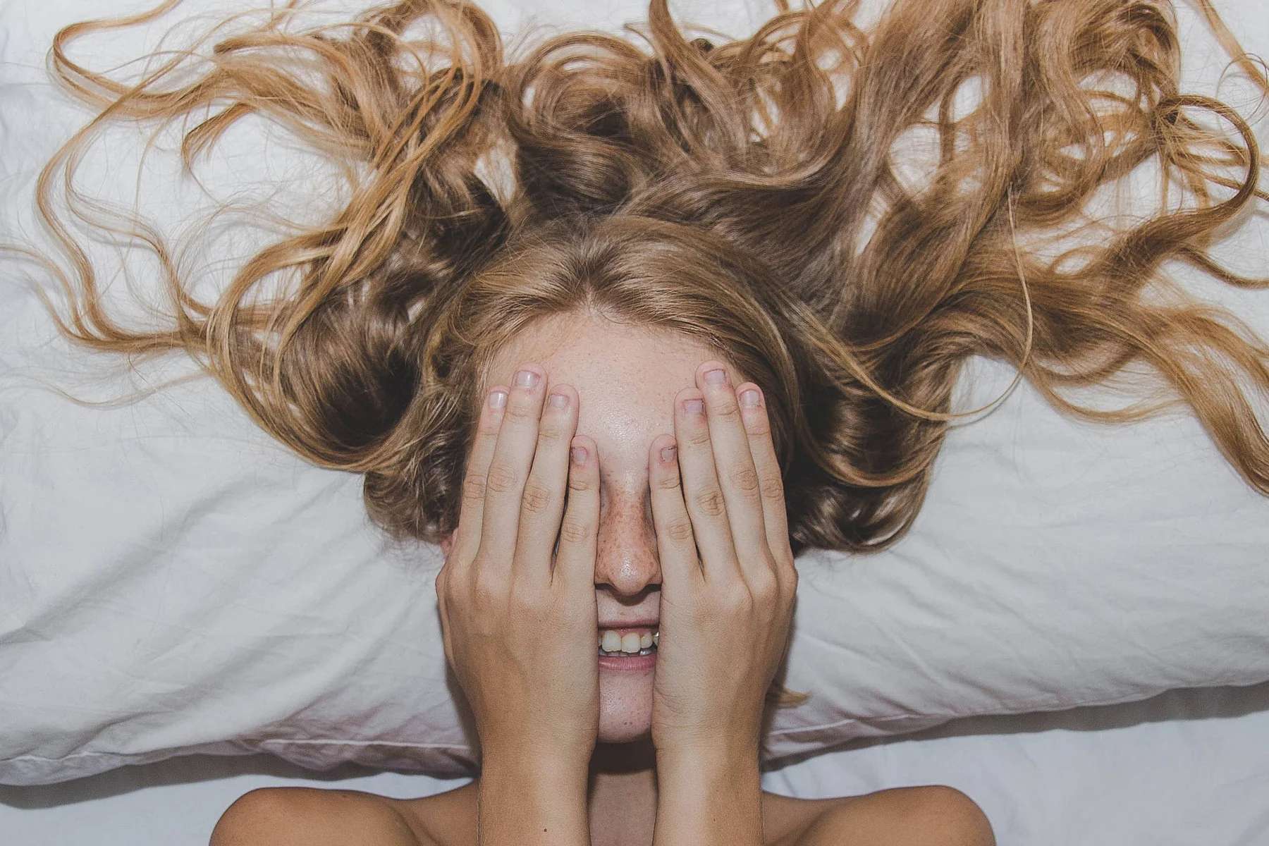 A young lady doesn't want to be disturbed from her sleep... the Air Support Pillow must be so good!