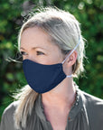 Woman Wearing a Kind Face Reusable Linen Face Mask in Navy Colour