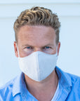 Man Wearing a Kind Face Reusable Linen Face Mask in Natural Colour