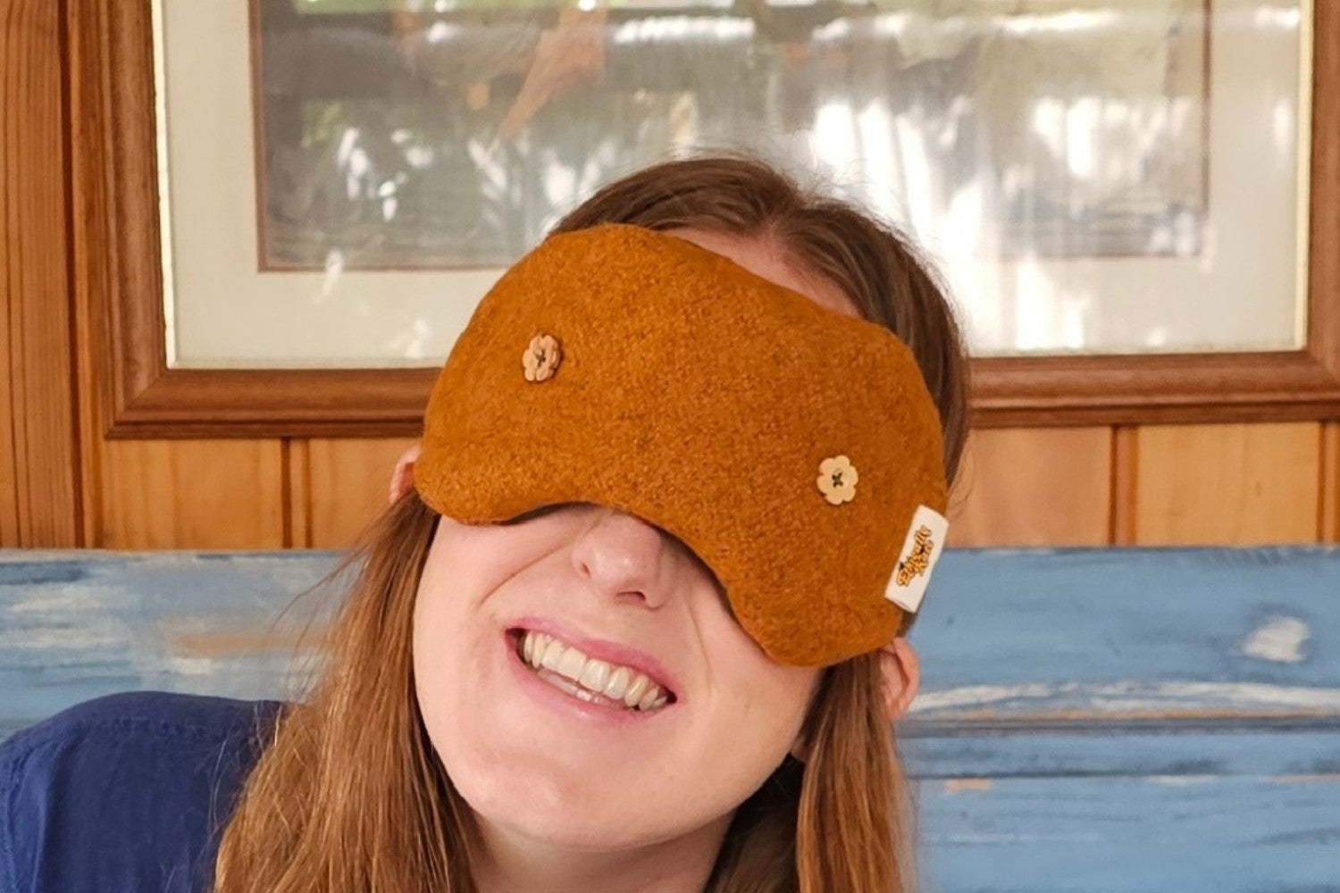 Ethically Kate showing off her limtied edition Weighted Eye Mask in Orchard Orange felted NZ wool