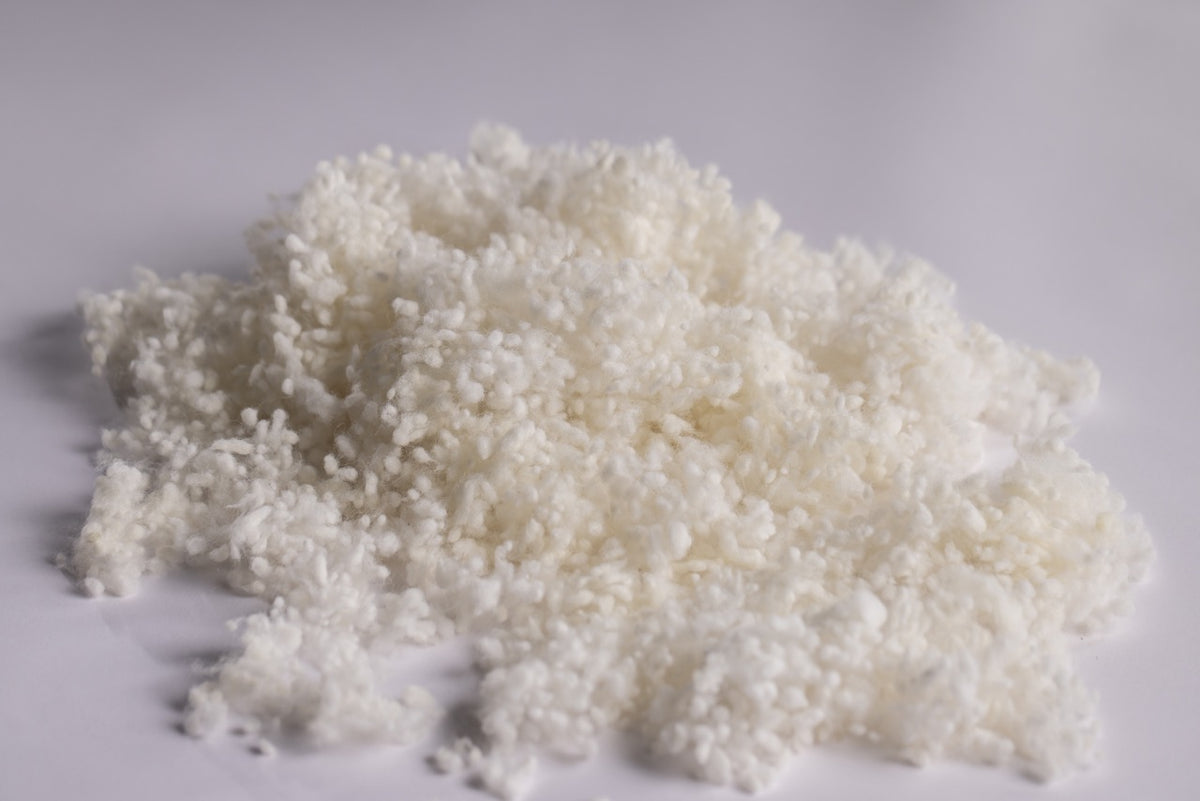 A pile of Wisewool loose wool fill