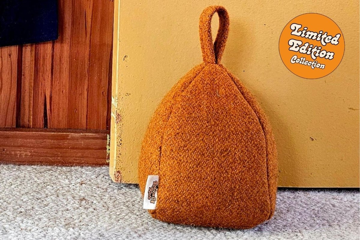 Close up picture of Ethically Kate's felted NZ wool door stop, in Orchard Orange colourway